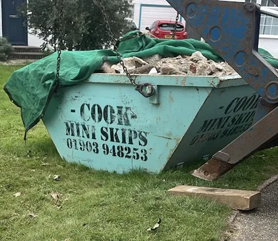 S J COOK LTD trading as Cook Mini Skips